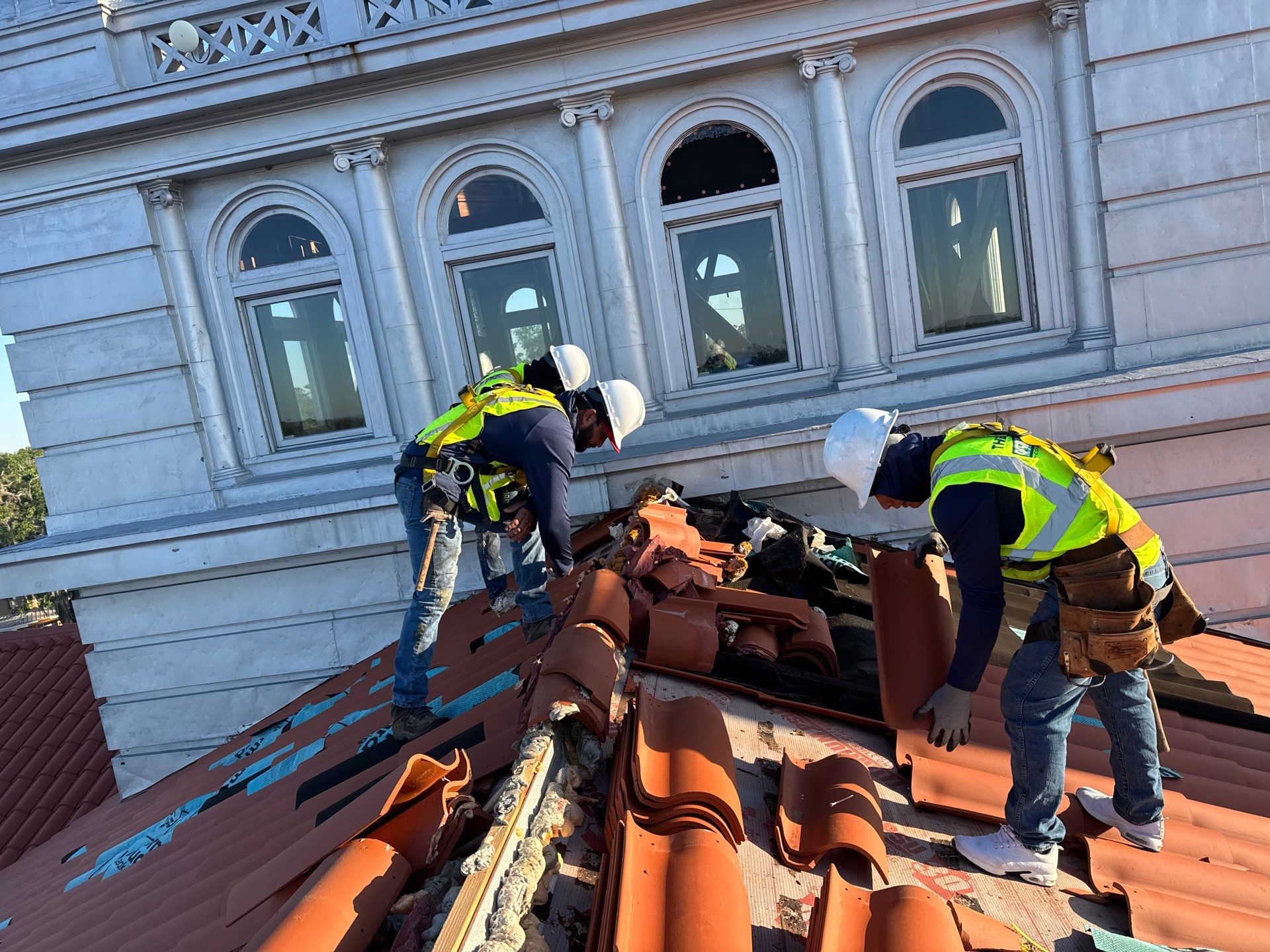 Clay tile staging on underlayment near courthouse dome